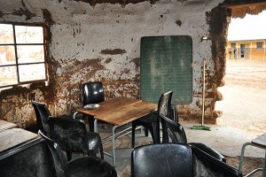 Chalkboard inside the Grade 7 classroom - a mud walled hut with no door.